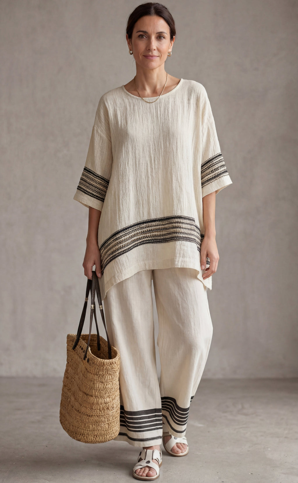Mariella — Top elegante de lino con rayas negras y pantalones fluidos